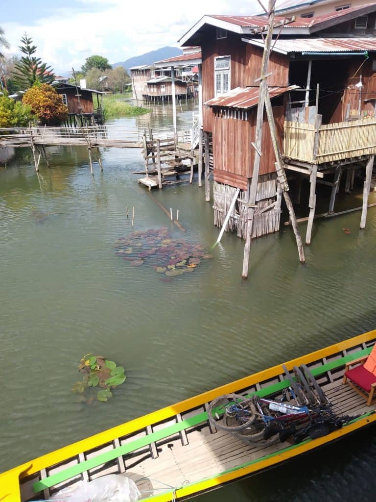 Swapping the bikes for the canoes at the floating village